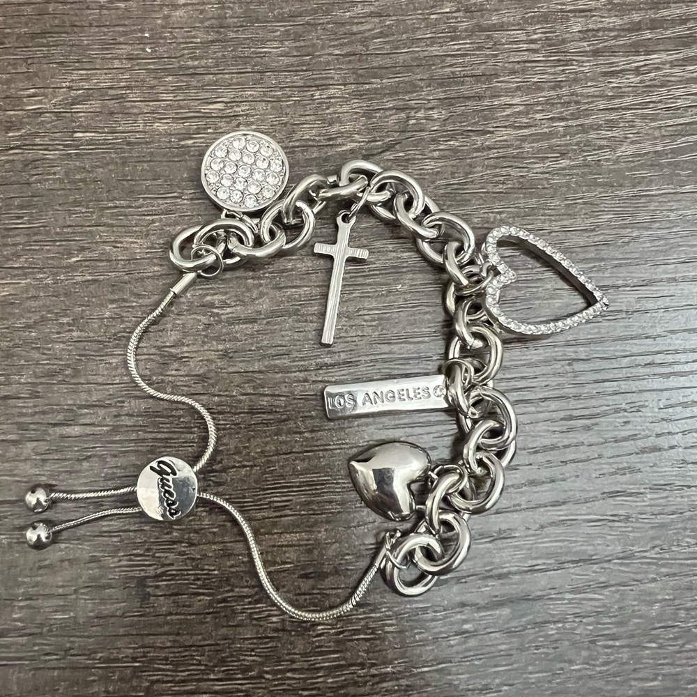 Guess Silvertone Charm Bracelet with adjustable closure